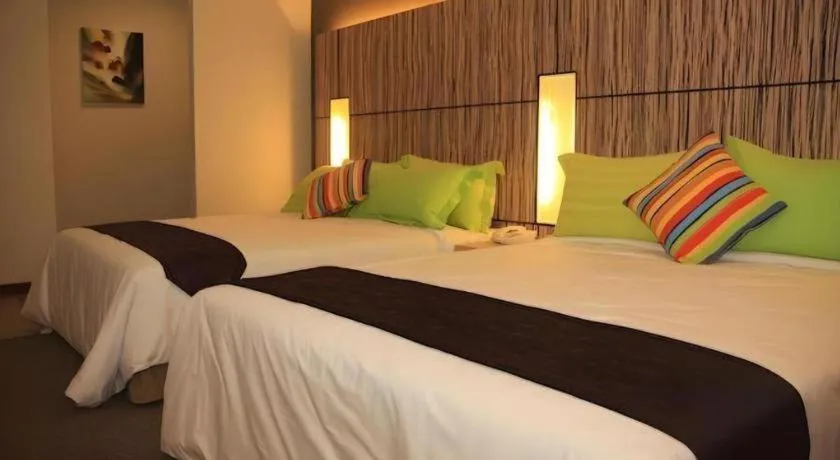 Bed in Grand Medallion Hotel