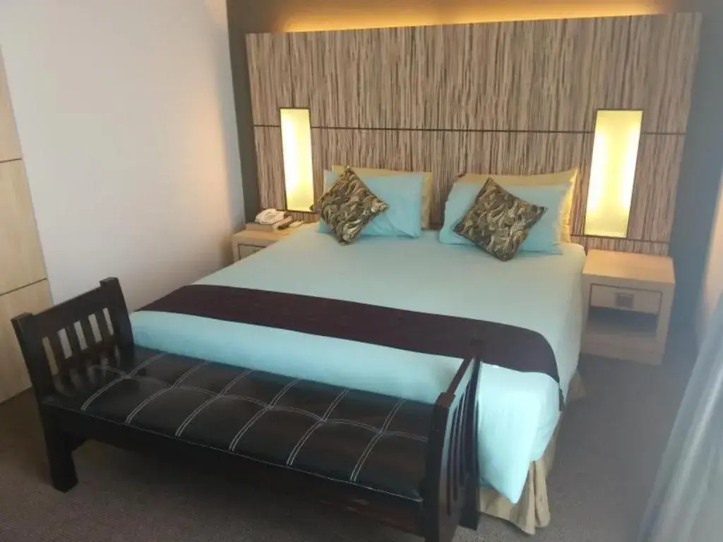 Bed in Grand Medallion Hotel Bed in Grand Medallion Hotel