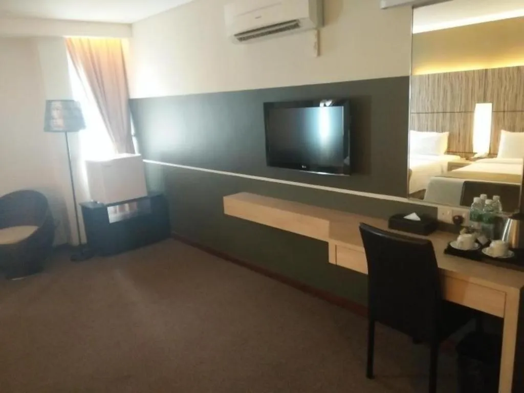 Bed in Grand Medallion Hotel