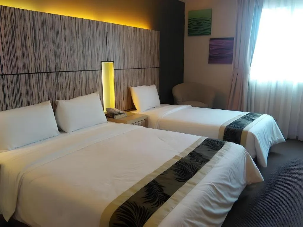 Bed in Grand Medallion Hotel