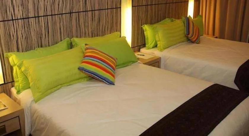 Bed in Grand Medallion Hotel