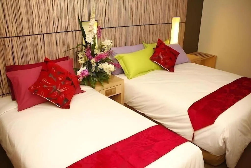 Bed in Grand Medallion Hotel