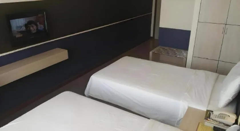 Bed in Grand Medallion Hotel