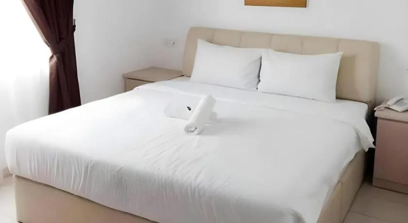 Bed in Peach Hill Hotel & Cafe