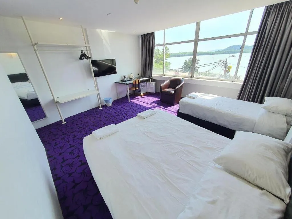 Bed in Riverine Garden Hotel