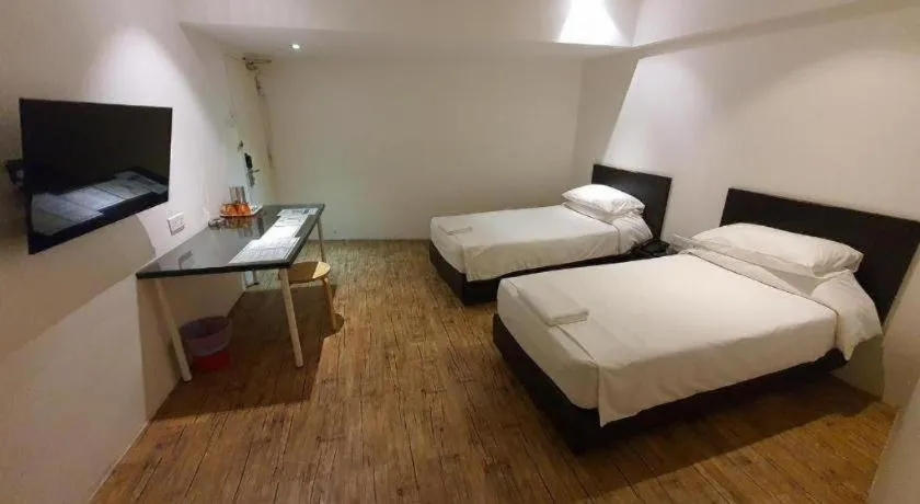 Bed in Riverine Garden Hotel