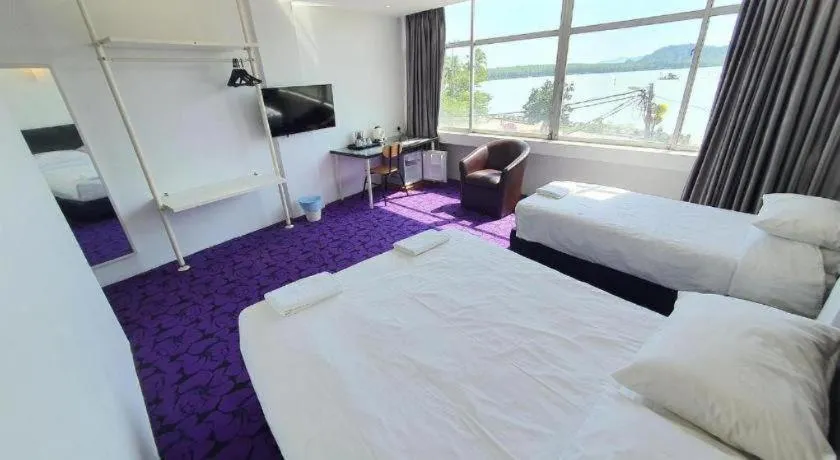 Bed in Riverine Garden Hotel