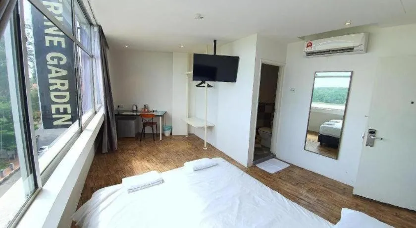 Bed in Riverine Garden Hotel