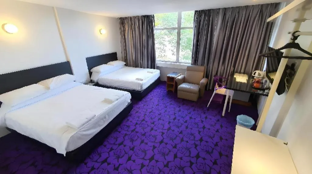 Bed in Riverine Garden Hotel