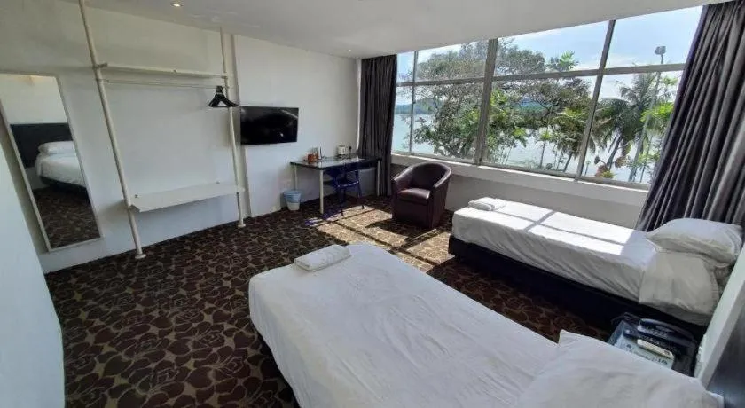 Bed in Riverine Garden Hotel