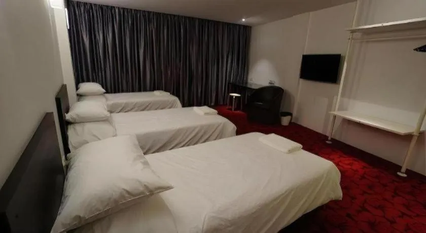 Bed in Riverine Garden Hotel