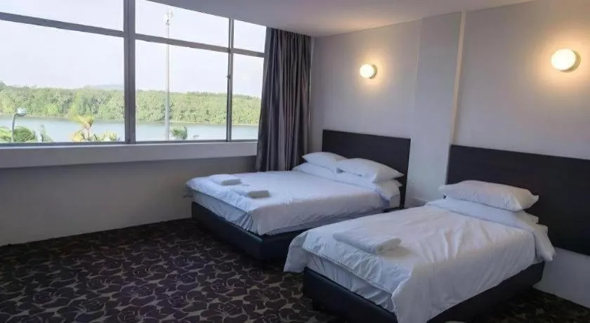 Bed in Riverine Garden Hotel