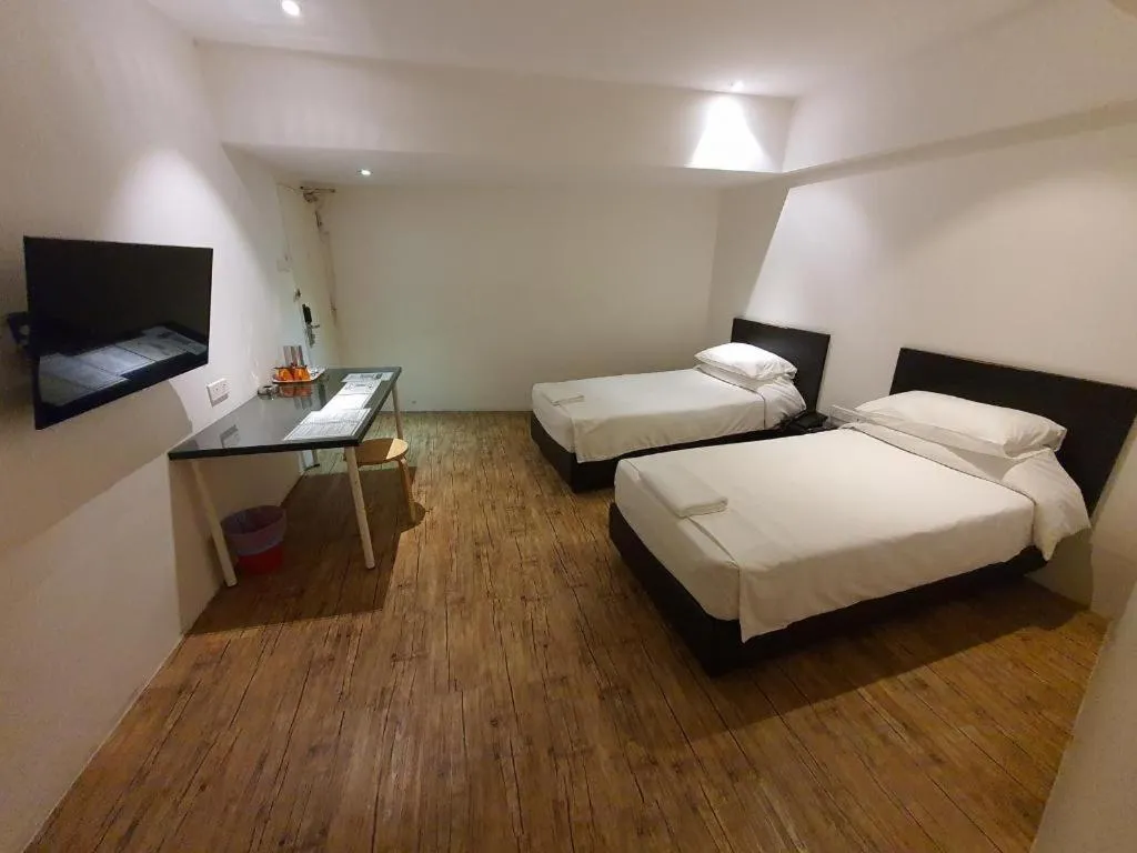 Bed in Riverine Garden Hotel