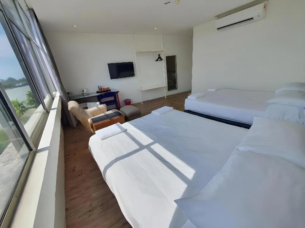 Bed in Riverine Garden Hotel