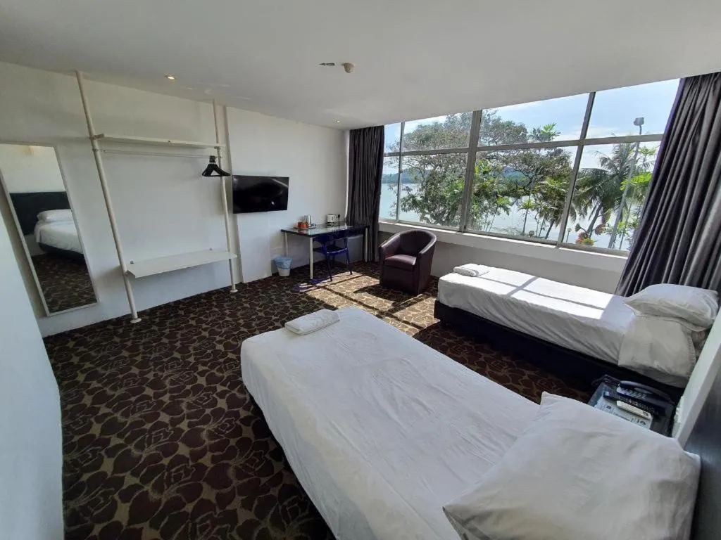 Bed in Riverine Garden Hotel