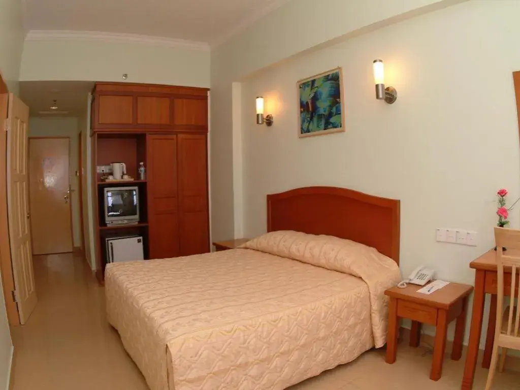 Bed in Li Hua Hotel Bintulu Bed in Li Hua Hotel Bintulu