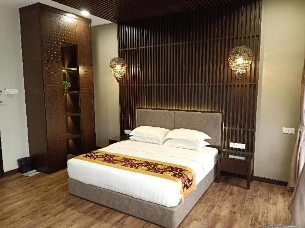 Bed in M GLOBAL HOTEL