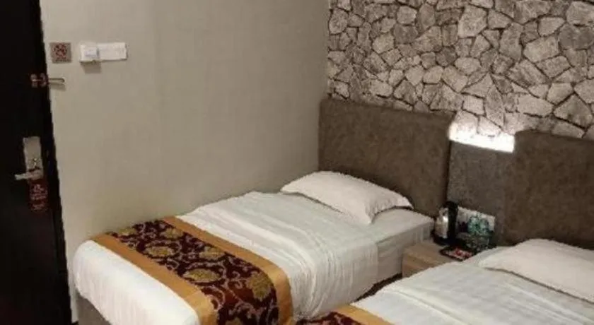 Bed in M GLOBAL HOTEL