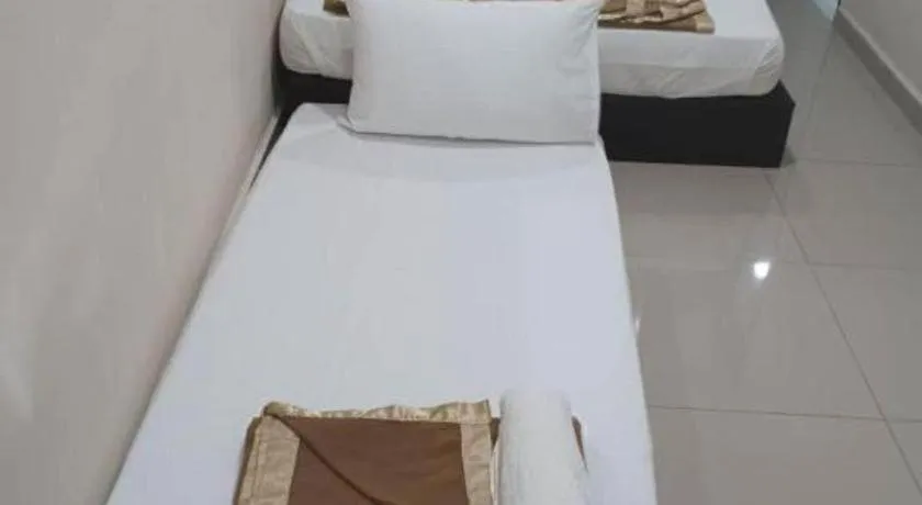 Bed in GEORGETOWN @ NEW WAVE HOTEL