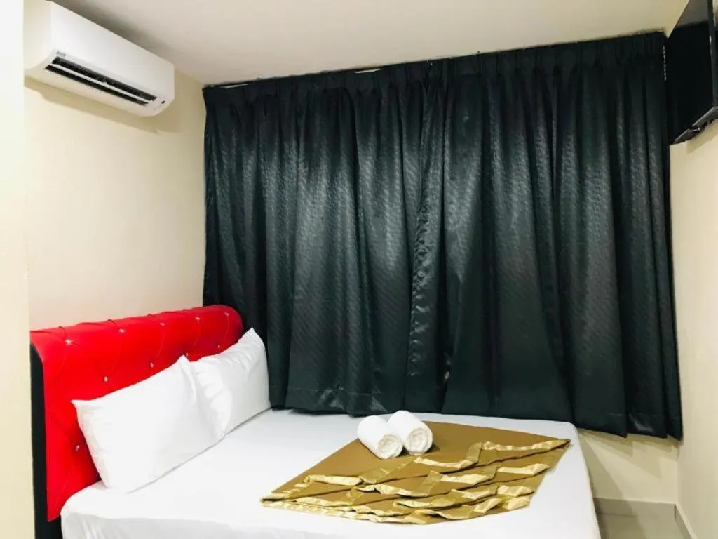 Bed in GEORGETOWN @ NEW WAVE HOTEL