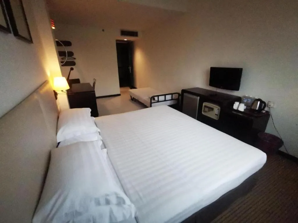 Bed in Ritz Garden Hotel