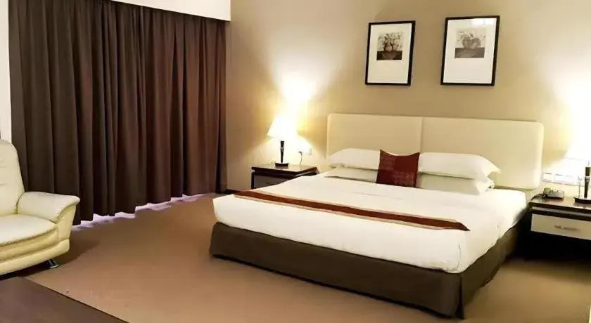 Bed in Ritz Garden Hotel Bed in Ritz Garden Hotel