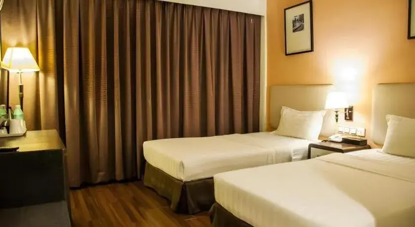 Bed in Ritz Garden Hotel Bed in Ritz Garden Hotel