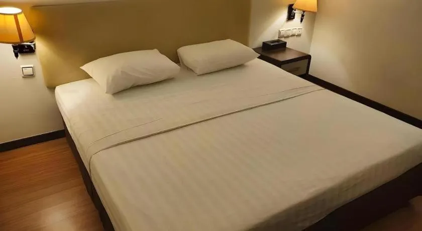 Bed in Ritz Garden Hotel