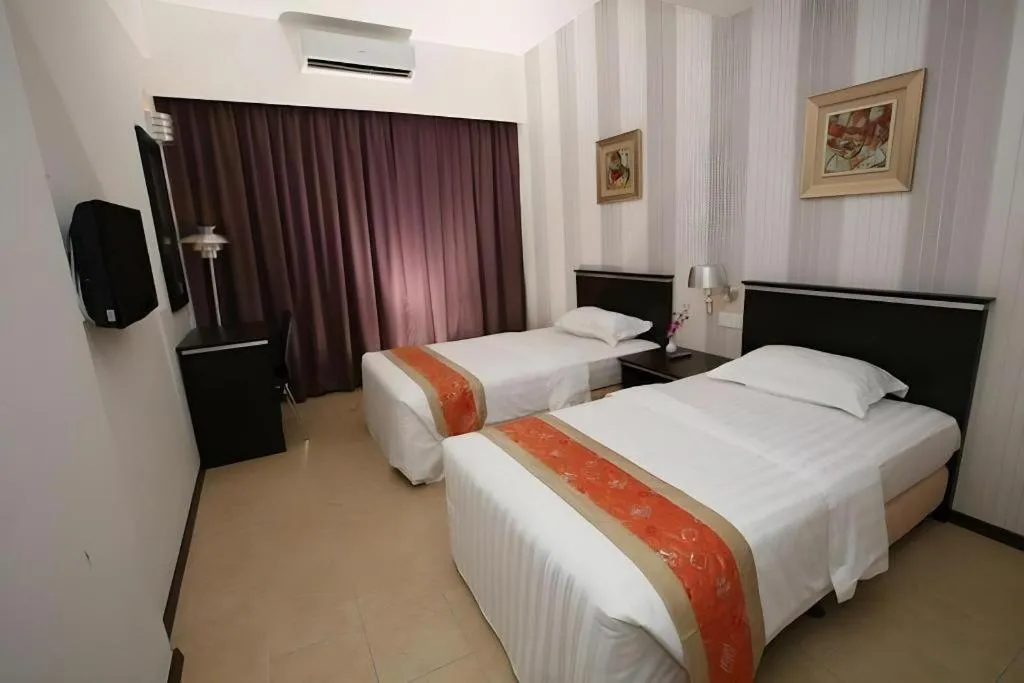 Bed in Ritz Garden Hotel