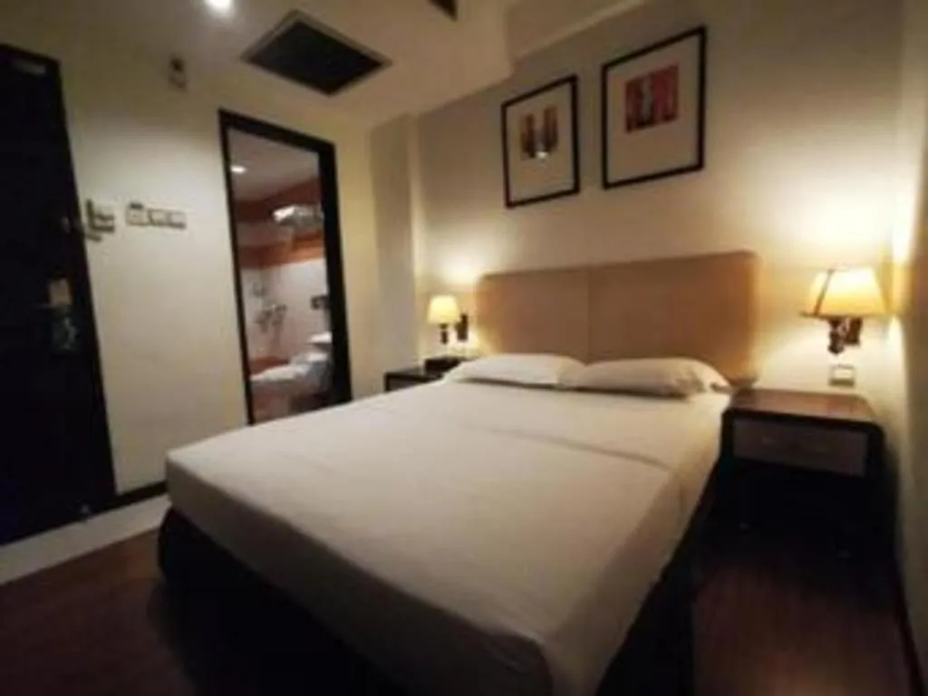 Bed in Ritz Garden Hotel