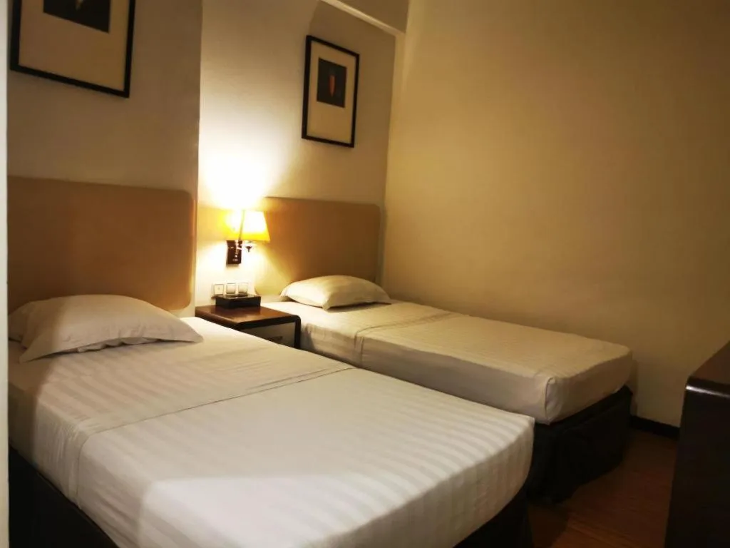 Bed in Ritz Garden Hotel