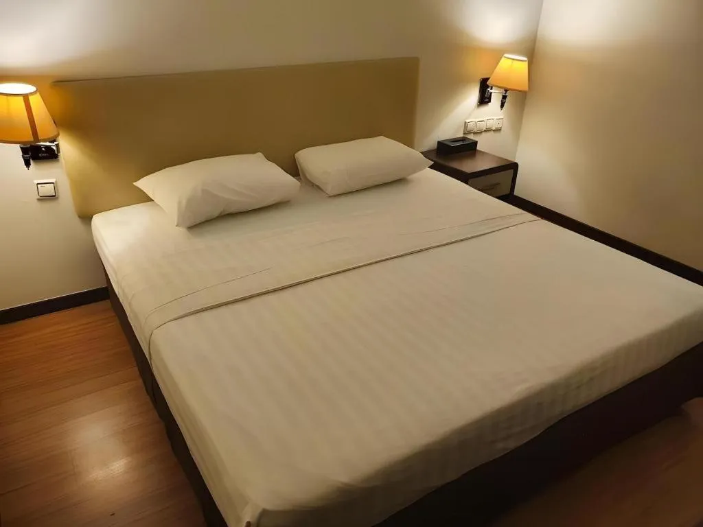 Bed in Ritz Garden Hotel