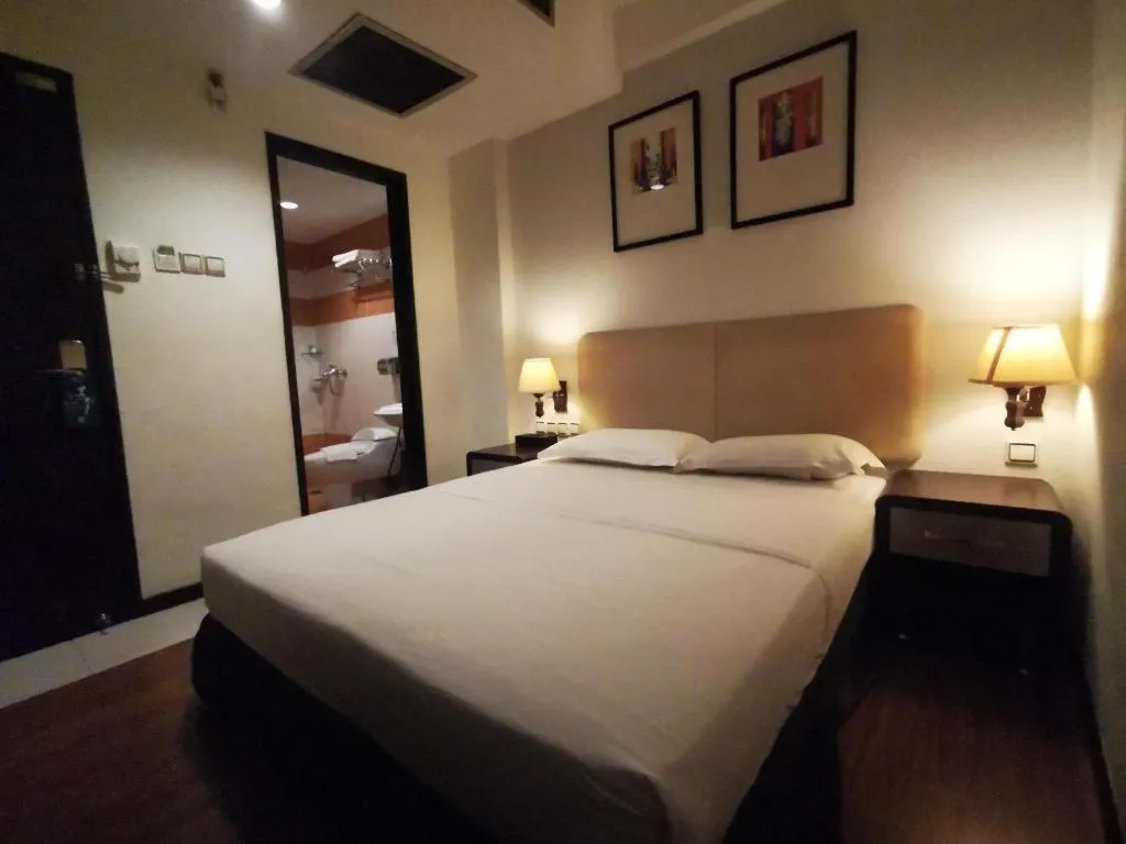 Bed in Ritz Garden Hotel