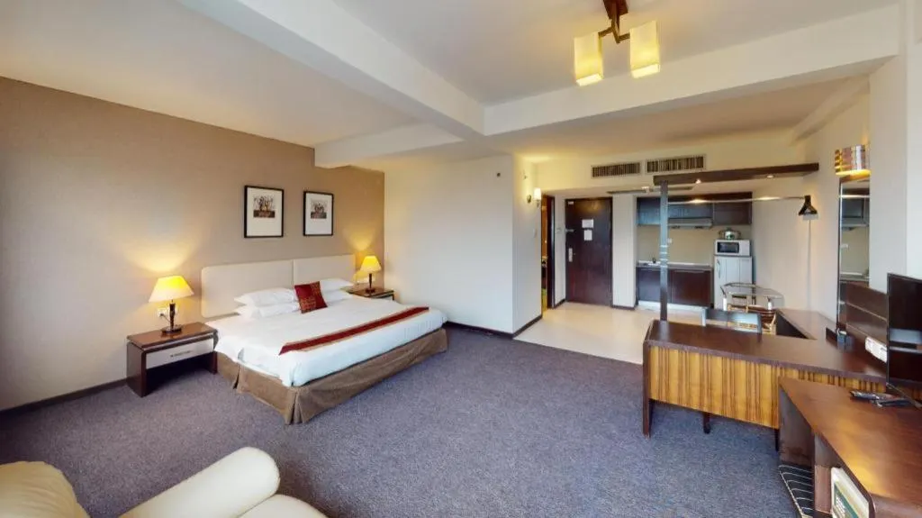 Bed in Ritz Garden Hotel