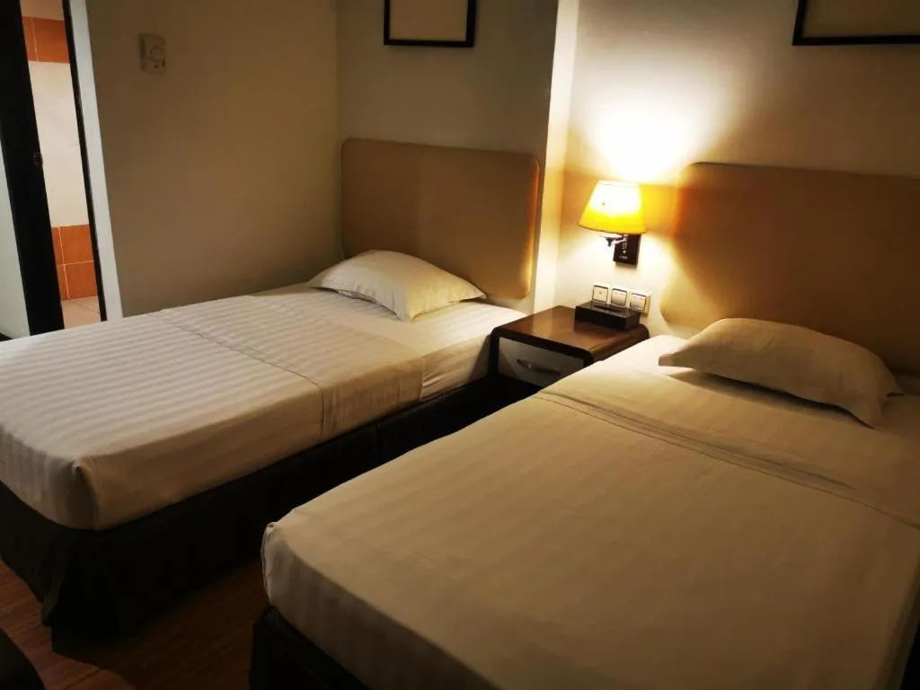 Bed in Ritz Garden Hotel