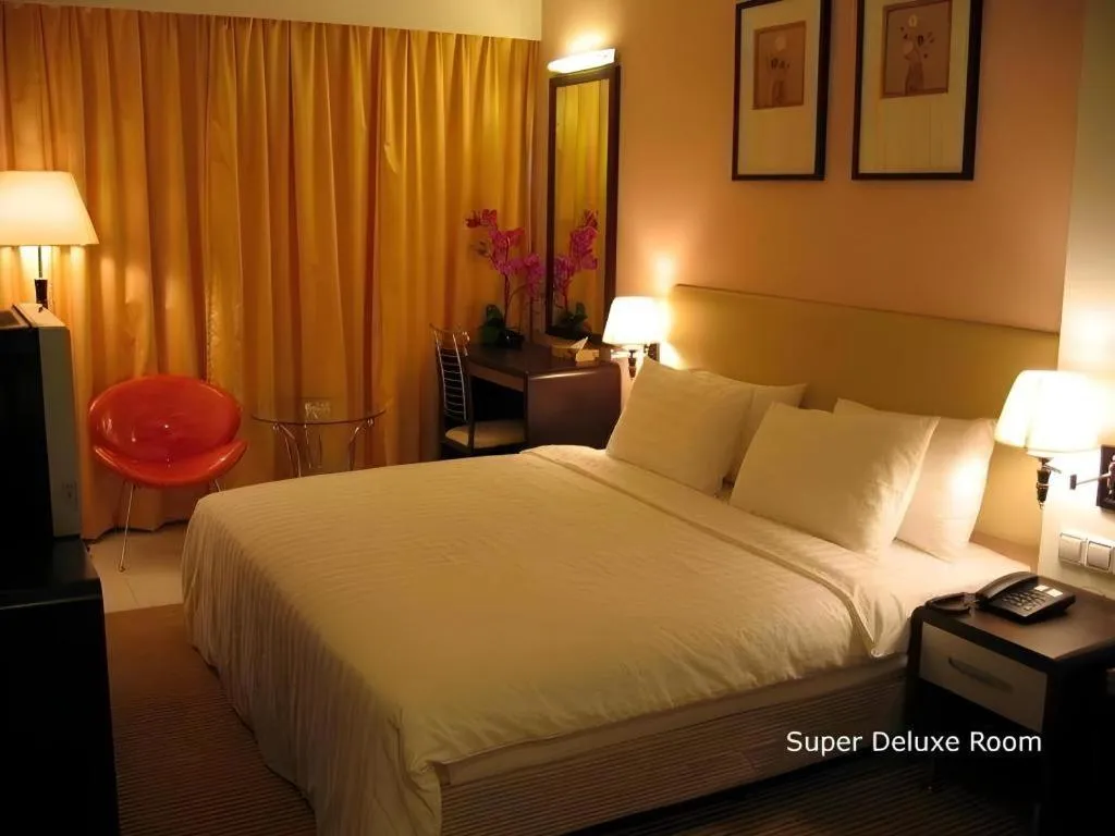 Bed in Ritz Garden Hotel