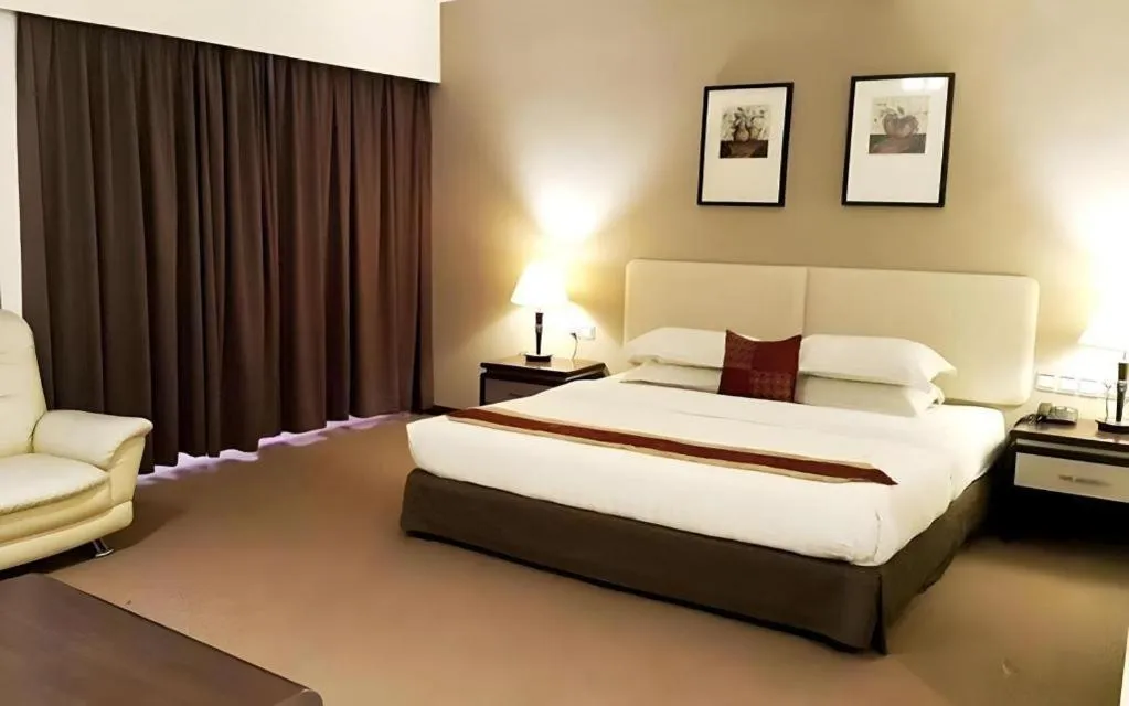 Bed in Ritz Garden Hotel