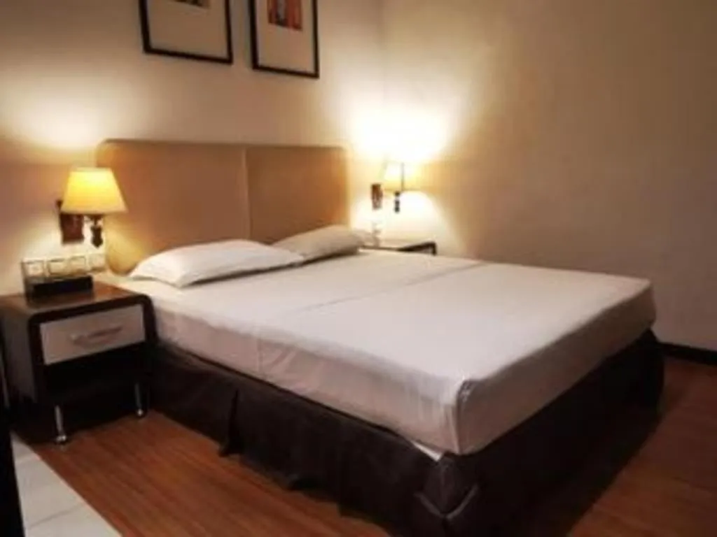 Bed in Ritz Garden Hotel