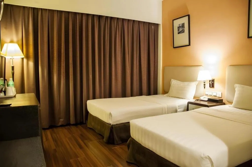 Bed in Ritz Garden Hotel