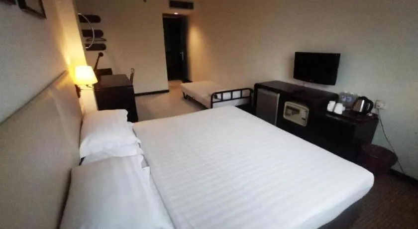 Bed in Ritz Garden Hotel