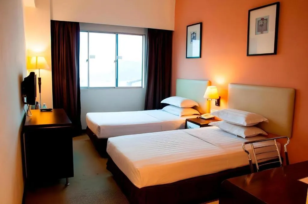 Bed in Ritz Garden Hotel