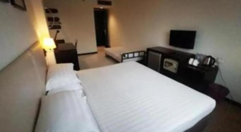 Bed in Ritz Garden Hotel