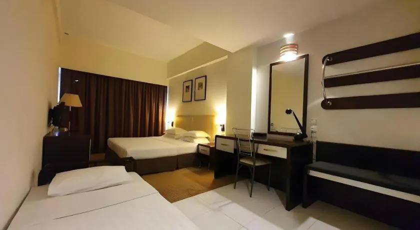 Bed in Ritz Garden Hotel