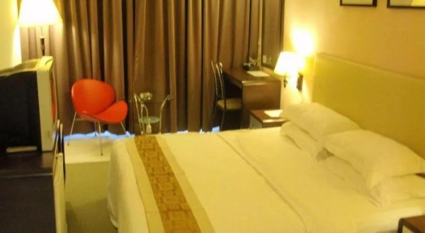 Bed in Ritz Garden Hotel