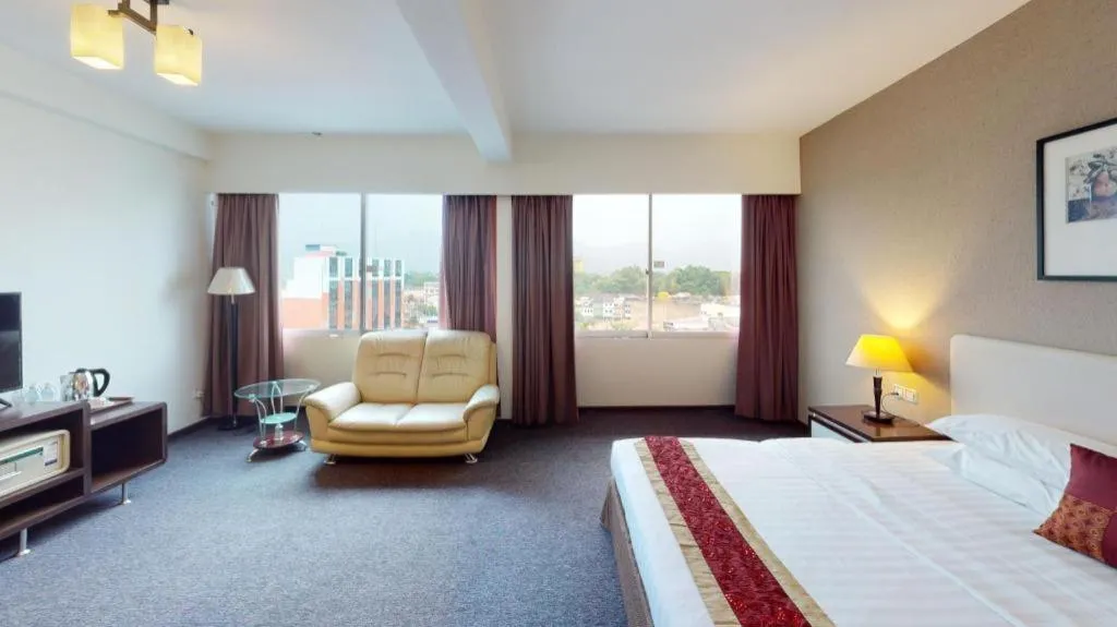 Bed in Ritz Garden Hotel