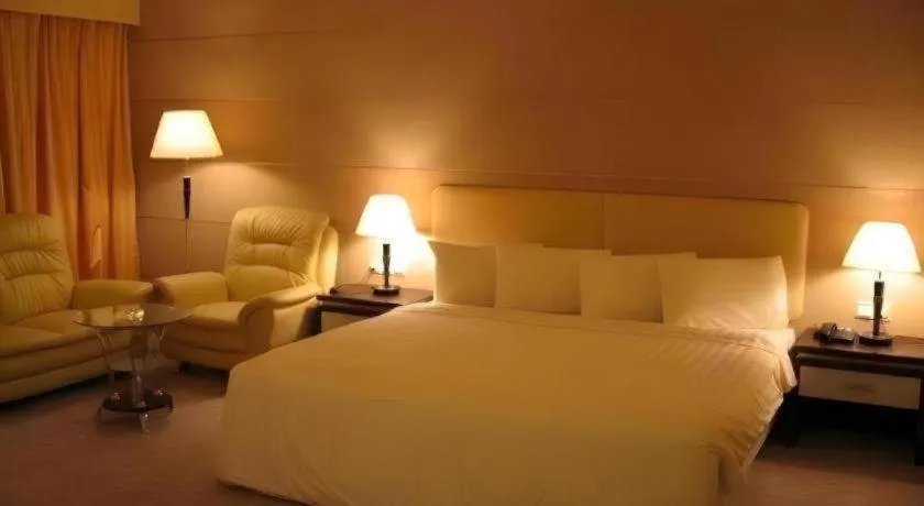 Bed in Ritz Garden Hotel