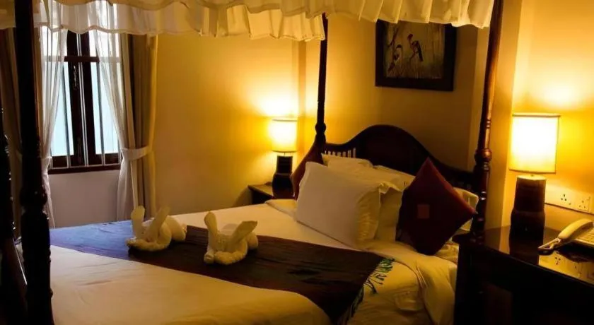 Bed in Anggun Boutique Hotel