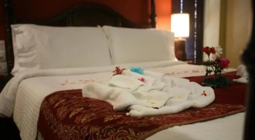 Bed in Anggun Boutique Hotel