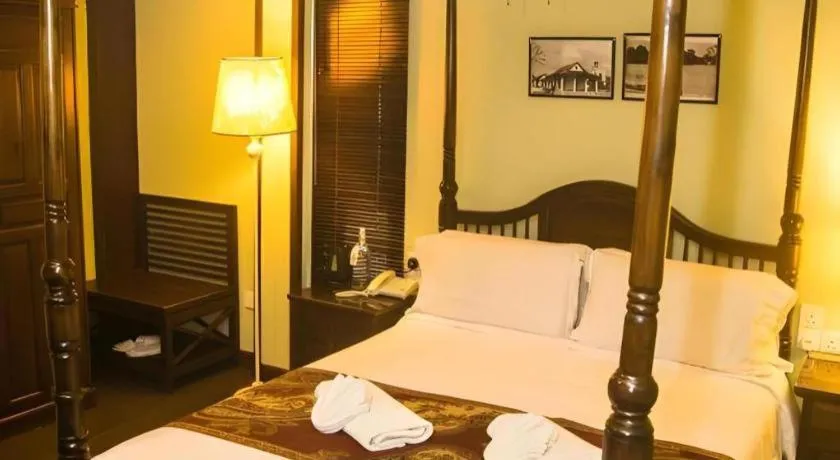 Bed in Anggun Boutique Hotel