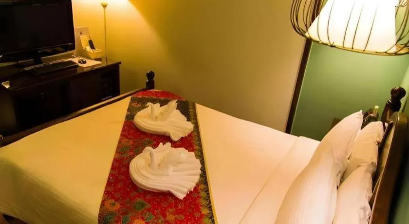 Bed in Anggun Boutique Hotel